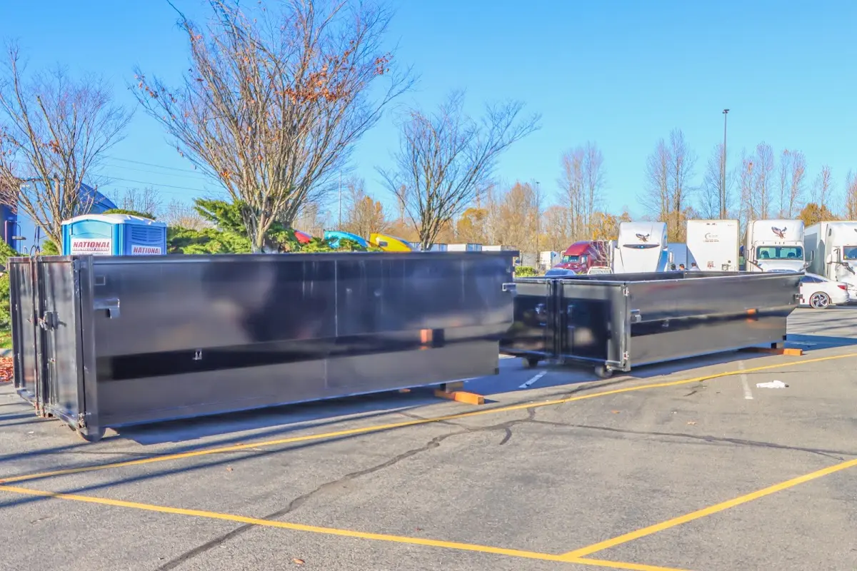Professional dumpster rental service with roll-off container on residential driveway in Lower Nazareth